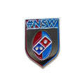 Metallic badge with '#NSW' text and Domino's logo on a white background